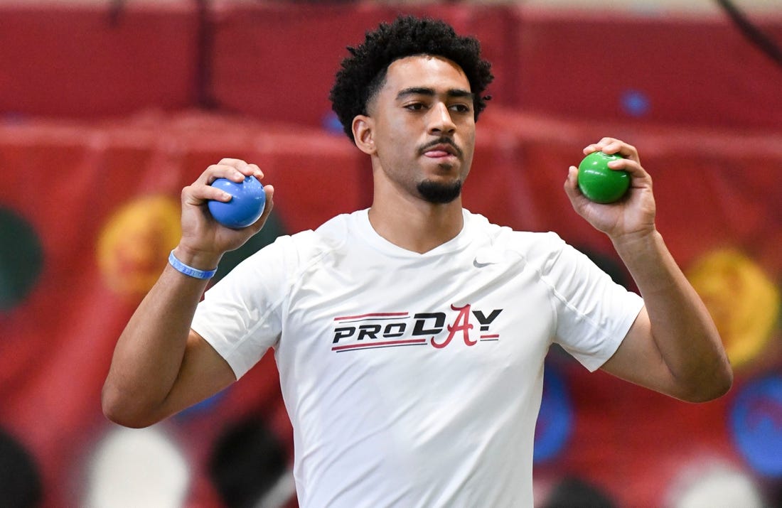 Mar 23, 2023; Tuscaloosa, AL, USA;  Quarterback Bryce Young uses balls to help him loosen up during Pro Day at Hank Crisp Indoor Practice Facility on the campus of the University of Alabama. Mandatory Credit: Gary Cosby Jr.-Tuscaloosa News

Ncaa Football University Of Alabama Pro Day