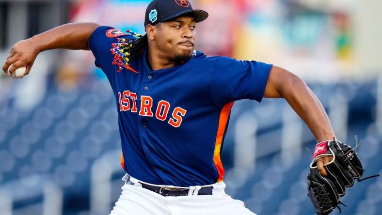 Mar 23, 2023; West Palm Beach, Florida, USA; Houston Astros starting pitcher Luis Garcia (77) throws a pitch against the Washington Nationals during the first inning at The Ballpark of the Palm Beaches. Mandatory Credit: Rich Storry-USA TODAY Sports