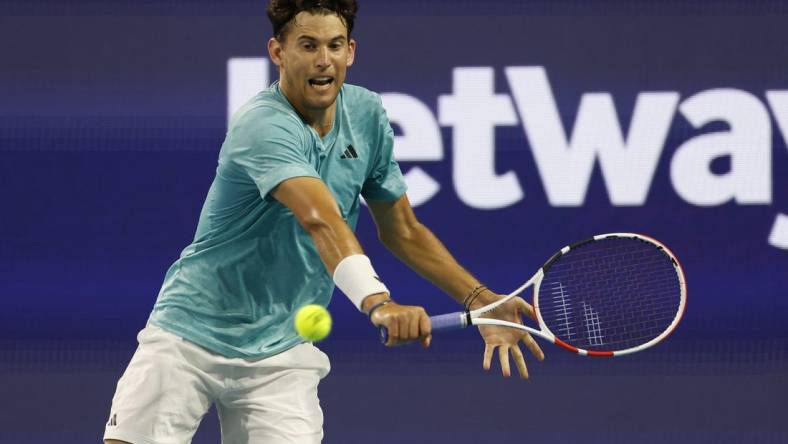 Mar 23, 2023; Miami, Florida, US; Dominic Thiem (AUT) hits a backhand against Lorenzo Sonego (ITA) (not pictured) on day four of the Miami Open at Hard Rock Stadium. Mandatory Credit: Geoff Burke-USA TODAY Sports