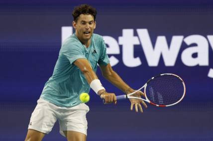 Mar 23, 2023; Miami, Florida, US; Dominic Thiem (AUT) hits a backhand against Lorenzo Sonego (ITA) (not pictured) on day four of the Miami Open at Hard Rock Stadium. Mandatory Credit: Geoff Burke-USA TODAY Sports