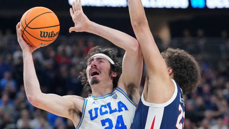 Mar 23, 2023; Las Vegas, NV, USA; UCLA Bruins guard Jaime Jaquez Jr. (24) shoots the ball against Gonzaga Bulldogs forward Anton Watson (22) during the second half at T-Mobile Arena. Mandatory Credit: Joe Camporeale-USA TODAY Sports