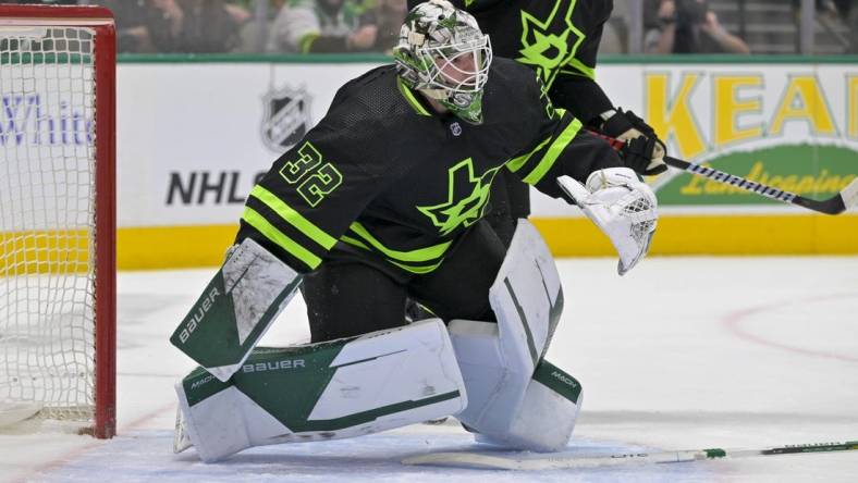 Mar 25, 2023; Dallas, Texas, USA; Dallas Stars goaltender Matt Murray (32) faces the Vancouver Canucks attack during the first period at the American Airlines Center. Mandatory Credit: Jerome Miron-USA TODAY Sports