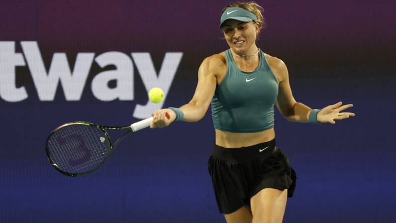 Mar 25, 2023; Miami, Florida, US; Paula Badosa (ESP) hits a forehand against Elena Rybakina (KAZ) (not pictured) on day six of the Miami Open at Hard Rock Stadium. Mandatory Credit: Geoff Burke-USA TODAY Sports