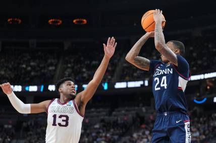 Mar 25, 2023; Las Vegas, NV, USA; Connecticut Huskies guard Jordan Hawkins (24) shoots the ball over Gonzaga Bulldogs guard Malachi Smith (13) during the second half for the NCAA tournament West Regional final at T-Mobile Arena. Mandatory Credit: Joe Camporeale-USA TODAY Sports