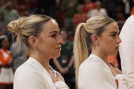 Mar 26, 2023; Greenville, SC, USA; Miami Hurricanes guard Haley Cavinder (14) and guard Hanna Cavinder (15) during the NCAA Women s Tournament against the LSU Lady Tigers  at Bon Secours Wellness Arena. Mandatory Credit: Jim Dedmon-USA TODAY Sports