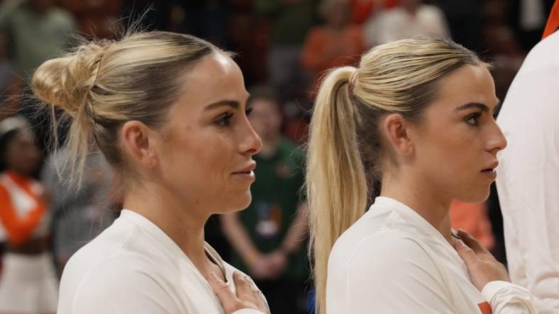 Mar 26, 2023; Greenville, SC, USA; Miami Hurricanes guard Haley Cavinder (14) and guard Hanna Cavinder (15) during the NCAA Women s Tournament against the LSU Lady Tigers  at Bon Secours Wellness Arena. Mandatory Credit: Jim Dedmon-USA TODAY Sports