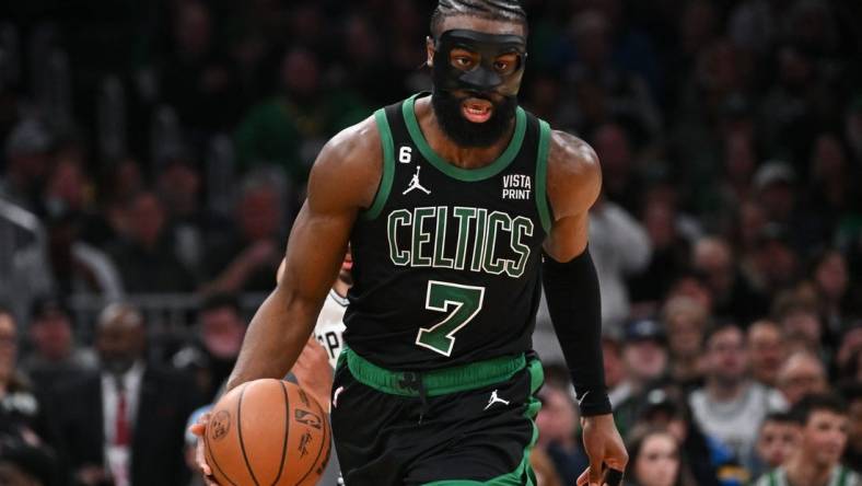 Mar 26, 2023; Boston, Massachusetts, USA; Boston Celtics guard Jaylen Brown (7) dribbles the ball against the San Antonio Spurs during the third quarter at the TD Garden. Mandatory Credit: Brian Fluharty-USA TODAY Sports