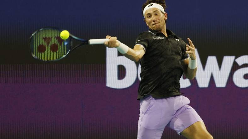 Mar 26, 2023; Miami, Florida, US; Casper Ruud (NOR) hits a forehand against Botic van de Zandschulp (NED) (not pictured) on day seven of the Miami Open at Hard Rock Stadium. Mandatory Credit: Geoff Burke-USA TODAY Sports