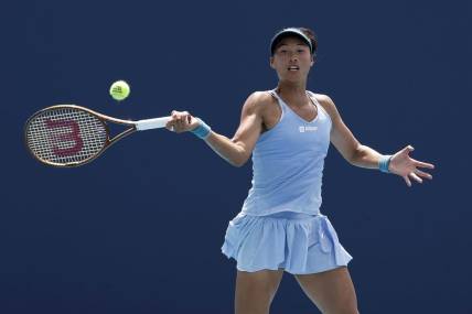 Mar 27, 2023; Miami, Florida, US; Qinwen Zheng (CHN) serves against Anastasia Potapova (not pictured) on day eight of the Miami Open at Hard Rock Stadium. Mandatory Credit: Geoff Burke-USA TODAY Sports