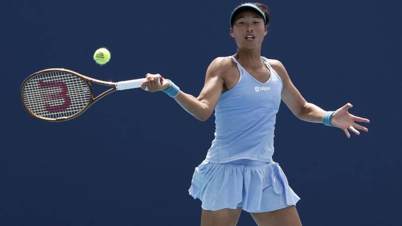 Mar 27, 2023; Miami, Florida, US; Qinwen Zheng (CHN) serves against Anastasia Potapova (not pictured) on day eight of the Miami Open at Hard Rock Stadium. Mandatory Credit: Geoff Burke-USA TODAY Sports