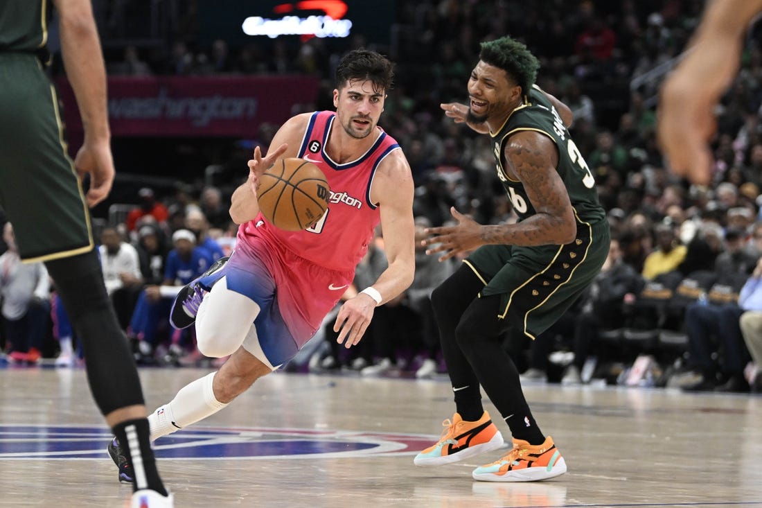 Mar 28, 2023; Washington, District of Columbia, USA; Washington Wizards forward Deni Avdija (9) dribbles past Boston Celtics guard Marcus Smart (36) during the second half at Capital One Arena. Mandatory Credit: Brad Mills-USA TODAY Sports