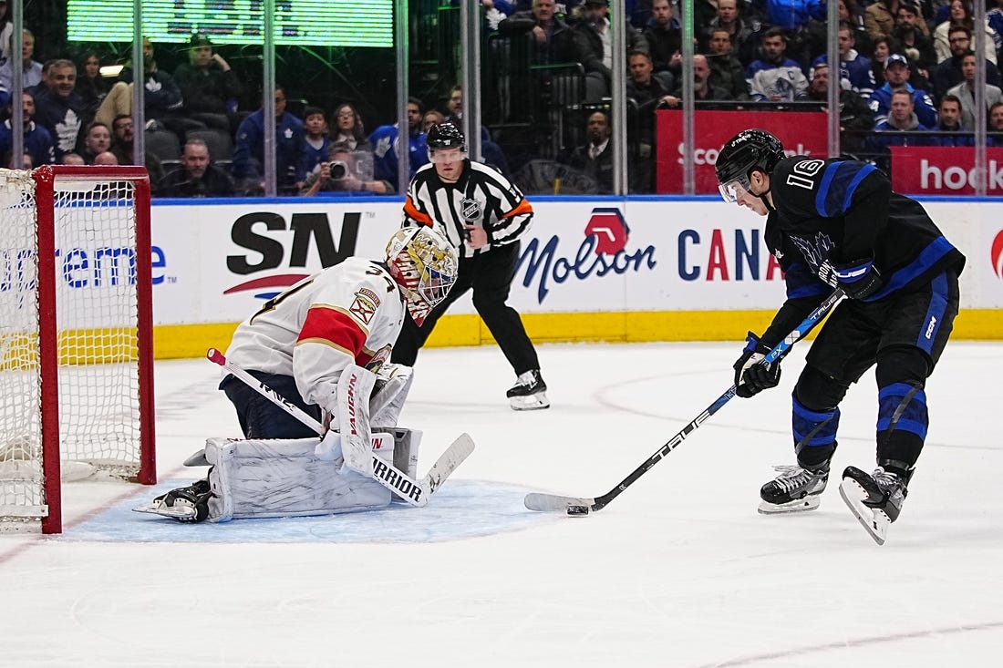 Mar 29, 2023; Toronto, Ontario, CAN; Toronto Maple Leafs forward Mitchell Marner (16) skates in on a breakaway against Florida Panthers goaltender Alex Lyon (34) during the third period at Scotiabank Arena. Mandatory Credit: John E. Sokolowski-USA TODAY Sports