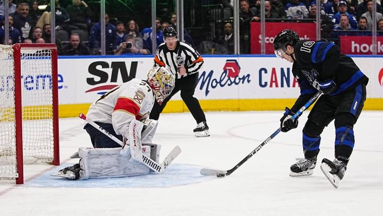 Mar 29, 2023; Toronto, Ontario, CAN; Toronto Maple Leafs forward Mitchell Marner (16) skates in on a breakaway against Florida Panthers goaltender Alex Lyon (34) during the third period at Scotiabank Arena. Mandatory Credit: John E. Sokolowski-USA TODAY Sports