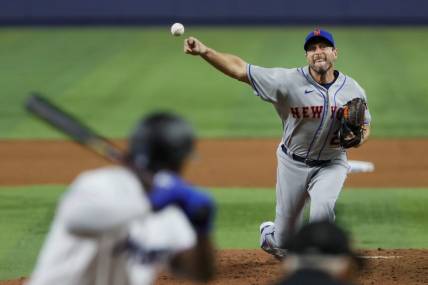 Mar 30, 2023; Miami, Florida, USA; New York Mets starting pitcher Max Scherzer (21) delivers a pitch during the fifth inning against the Miami Marlins at loanDepot Park. Mandatory Credit: Sam Navarro-USA TODAY Sports
