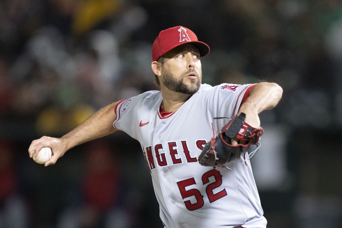 March 30, 2023; Oakland, California, USA; Los Angeles Angels relief pitcher Ryan Tepera (52) delivers a pitch against the Oakland Athletics during the eighth inning at RingCentral Coliseum. Mandatory Credit: Kyle Terada-USA TODAY Sports