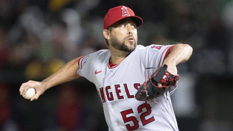 March 30, 2023; Oakland, California, USA; Los Angeles Angels relief pitcher Ryan Tepera (52) delivers a pitch against the Oakland Athletics during the eighth inning at RingCentral Coliseum. Mandatory Credit: Kyle Terada-USA TODAY Sports