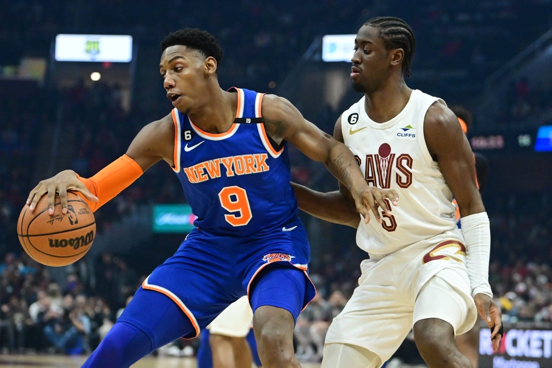 Mar 31, 2023; Cleveland, Ohio, USA; Cleveland Cavaliers guard Caris LeVert (3) defends against New York Knicks guard RJ Barrett (9) during the first half at Rocket Mortgage FieldHouse. Mandatory Credit: Ken Blaze-USA TODAY Sports