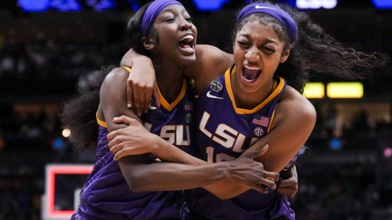 Mar 31, 2023; Dallas, TX, USA; LSU Lady Tigers guard Flau'jae Johnson, left, celebrates with forward Angel Reese after defeating the Virginia Tech Hokies in semifinals of the women's Final Four of the 2023 NCAA Tournament at American Airlines Center. Mandatory Credit: Kirby Lee-USA TODAY Sports