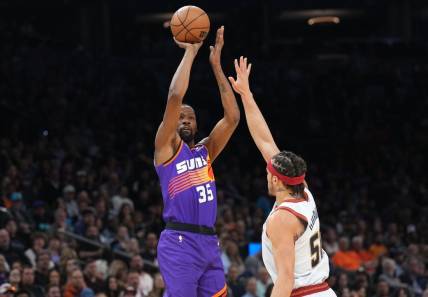 Mar 31, 2023; Phoenix, Arizona, USA; Phoenix Suns forward Kevin Durant (35) shoots over Denver Nuggets forward Aaron Gordon (50) during the first half at Footprint Center. Mandatory Credit: Joe Camporeale-USA TODAY Sports