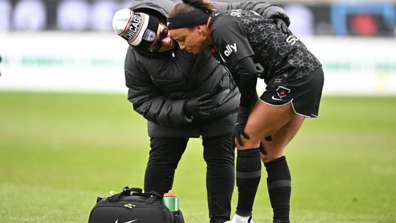 Apr 1, 2023; Bridgeview, Illinois, USA; Chicago Red Stars forward Mallory Swanson (9) receives medical treatment after an injury at SeatGeek Stadium. Mandatory Credit: Daniel Bartel-USA TODAY Sports