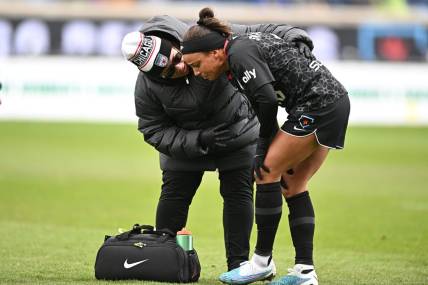 Apr 1, 2023; Bridgeview, Illinois, USA; Chicago Red Stars forward Mallory Swanson (9) receives medical treatment after an injury at SeatGeek Stadium. Mandatory Credit: Daniel Bartel-USA TODAY Sports