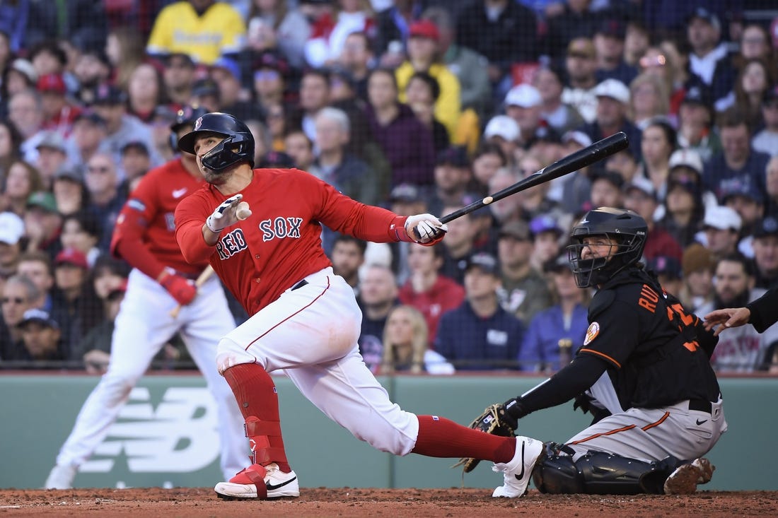 Apr 1, 2023; Boston, Massachusetts, USA;  Boston Red Sox center fielder Adam Duvall (18) hits a two-run home run during the third inning against the Baltimore Orioles at Fenway Park. Mandatory Credit: Bob DeChiara-USA TODAY Sports