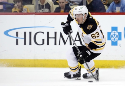 Apr 1, 2023; Pittsburgh, Pennsylvania, USA;  Boston Bruins left wing Brad Marchand (63) skates with the puck against the Pittsburgh Penguins during the third period at PPG Paints Arena. Boston won 4-3. Mandatory Credit: Charles LeClaire-USA TODAY Sports