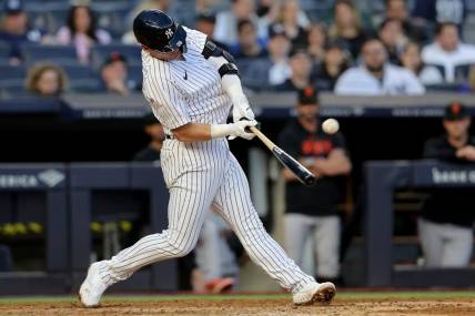 Apr 1, 2023; Bronx, New York, USA; New York Yankees third baseman Josh Donaldson (28) hits a solo home run against the San Francisco Giants during the eighth inning at Yankee Stadium. Mandatory Credit: Brad Penner-USA TODAY Sports