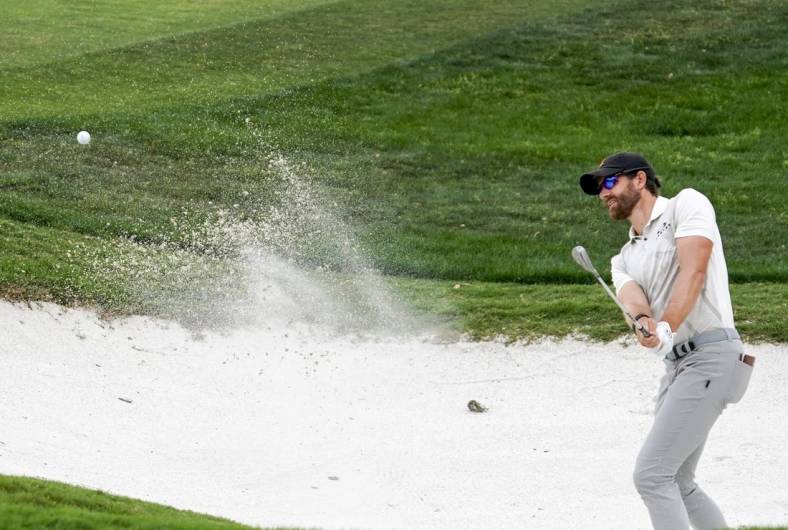 Apr 1, 2023; San Antonio, Texas, USA; Patrick Rodgers plays a shot from a bunker on the 18th hole during the third round of the Valero Texas Open golf tournament. Mandatory Credit: Raymond Carlin III-USA TODAY Sports
