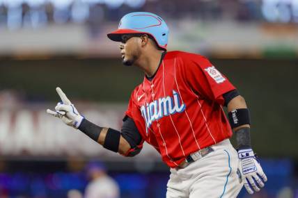 Apr 1, 2023; Miami, Florida, USA; Miami Marlins second baseman Luis Arraez (3) reacts from first base after a base hit during the second inning against the New York Mets at loanDepot Park. Mandatory Credit: Sam Navarro-USA TODAY Sports