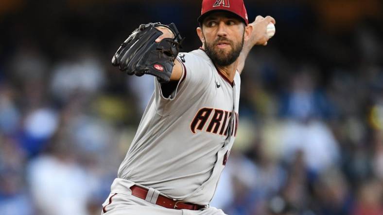 Apr 1, 2023; Los Angeles, California, USA; Arizona Diamondbacks starting pitcher Madison Bumgarner (40) throws a pitch against the Los Angeles Dodgers during the first inning at Dodger Stadium. Mandatory Credit: Jonathan Hui-USA TODAY Sports