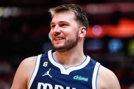 Apr 1, 2023; Miami, Florida, USA; Dallas Mavericks guard Luka Doncic (77) reacts to a foul against the Miami Heat during the third quarter at Miami-Dade Arena. Mandatory Credit: Rich Storry-USA TODAY Sports