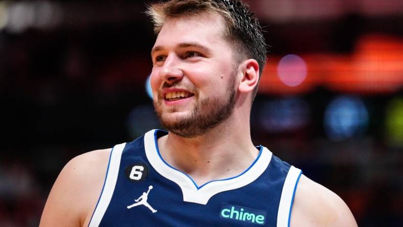 Apr 1, 2023; Miami, Florida, USA; Dallas Mavericks guard Luka Doncic (77) reacts to a foul against the Miami Heat during the third quarter at Miami-Dade Arena. Mandatory Credit: Rich Storry-USA TODAY Sports