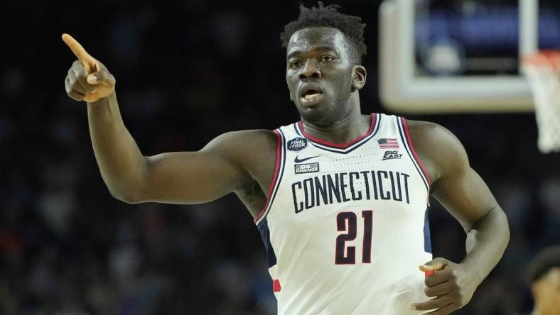 Apr 1, 2023; Houston, TX, USA; Connecticut Huskies forward Adama Sanogo (21) reacts after a play against the Miami (Fl) Hurricanes during the second half in the semifinals of the Final Four of the 2023 NCAA Tournament at NRG Stadium. Mandatory Credit: Bob Donnan-USA TODAY Sports