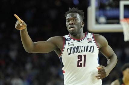 Apr 1, 2023; Houston, TX, USA; Connecticut Huskies forward Adama Sanogo (21) reacts after a play against the Miami (Fl) Hurricanes during the second half in the semifinals of the Final Four of the 2023 NCAA Tournament at NRG Stadium. Mandatory Credit: Bob Donnan-USA TODAY Sports