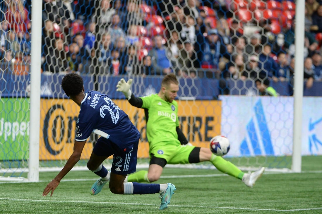 Apr 1, 2023; Vancouver, British Columbia, CAN; CF Montreal goalkeeper Jonathan Sirois (40) makes a save against Vancouver Whitecaps forward Ali Ahmed (22) during the first half at BC Place. Mandatory Credit: Anne-Marie Sorvin-USA TODAY Sports