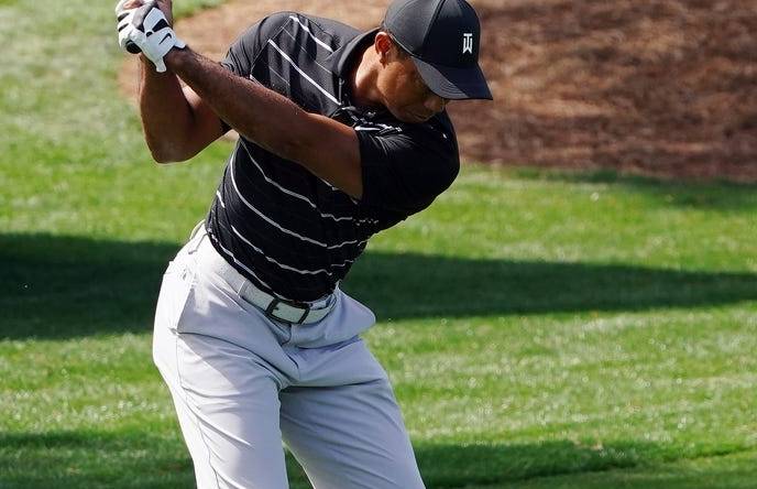 Apr 2, 2023; Augusta, Georgia, USA; Tiger Woods warms up on the practice range in preparation for the Masters Tournament at Augusta National Golf Club. Mandatory Credit: Katie Goodale-USA TODAY Sports