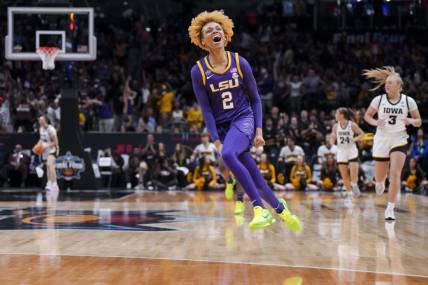 Apr 2, 2023; Dallas, TX, USA; LSU Lady Tigers guard Jasmine Carson (2) yells as she runs on the court in the game against the Iowa Hawkeyes in the first half during the final round of the Women's Final Four NCAA tournament at the American Airlines Center. Mandatory Credit: Kirby Lee-USA TODAY Sports