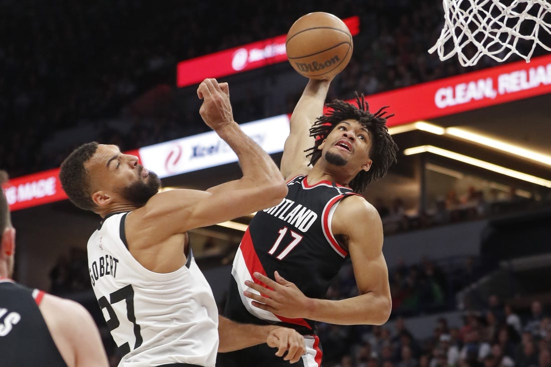 Apr 2, 2023; Minneapolis, Minnesota, USA; Portland Trail Blazers guard Shaedon Sharpe (17) looks to dunk on Minnesota Timberwolves center Rudy Gobert (27) in the first quarter at Target Center. Mandatory Credit: Bruce Kluckhohn-USA TODAY Sports