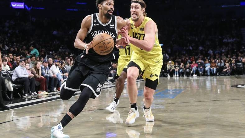 Apr 2, 2023; Brooklyn, New York, USA;  Brooklyn Nets guard Spencer Dinwiddie (26) looks to drive past Utah Jazz forward Kelly Olynyk (41) in the second quarter at Barclays Center. Mandatory Credit: Wendell Cruz-USA TODAY Sports