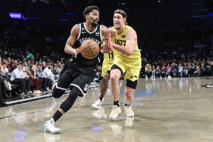 Apr 2, 2023; Brooklyn, New York, USA;  Brooklyn Nets guard Spencer Dinwiddie (26) looks to drive past Utah Jazz forward Kelly Olynyk (41) in the second quarter at Barclays Center. Mandatory Credit: Wendell Cruz-USA TODAY Sports