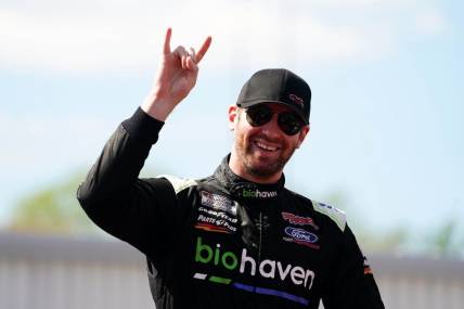 Apr 2, 2023; Richmond, Virginia, USA; Cody Ware waves to fans before the race during the Toyota Owners 400 at Richmond Raceway. Mandatory Credit: John David Mercer-USA TODAY Sports