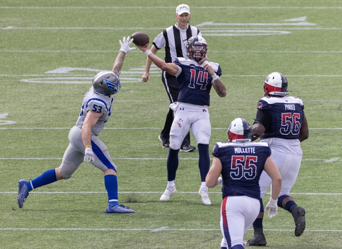 Apr 2, 2023; Houston, TX, USA;  Houston Roughnecks quarterback Cole McDonald (14) pass is deflected by St. Louis Battlehawks  linebacker Carson Wells (53) in the fourth quarter at TDECU Stadium. Mandatory Credit: Thomas Shea-USA TODAY Sports