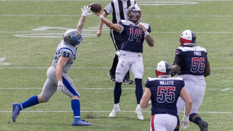 Apr 2, 2023; Houston, TX, USA;  Houston Roughnecks quarterback Cole McDonald (14) pass is deflected by St. Louis Battlehawks  linebacker Carson Wells (53) in the fourth quarter at TDECU Stadium. Mandatory Credit: Thomas Shea-USA TODAY Sports