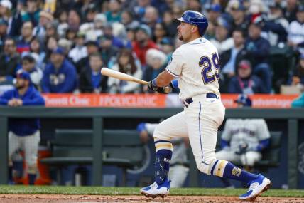 Apr 2, 2023; Seattle, Washington, USA; Seattle Mariners catcher Cal Raleigh (29) hits a two-run double against the Cleveland Guardians during the third inning at T-Mobile Park. Mandatory Credit: Joe Nicholson-USA TODAY Sports