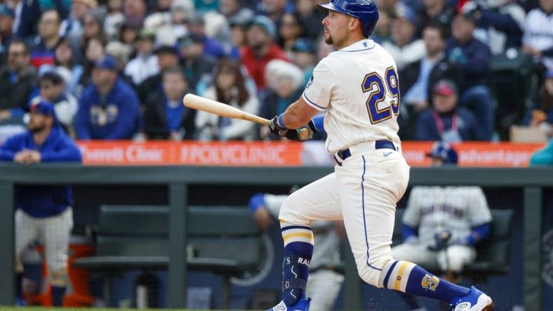 Apr 2, 2023; Seattle, Washington, USA; Seattle Mariners catcher Cal Raleigh (29) hits a two-run double against the Cleveland Guardians during the third inning at T-Mobile Park. Mandatory Credit: Joe Nicholson-USA TODAY Sports