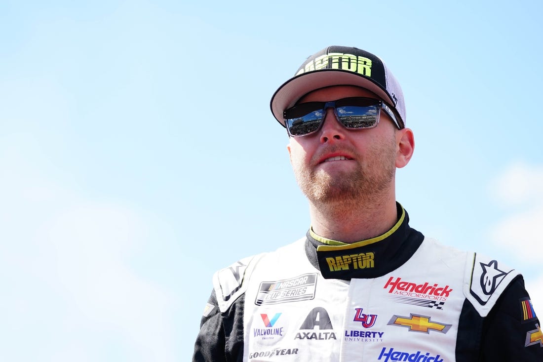 Apr 2, 2023; Richmond, Virginia, USA; Alex Bowman (48) reacts with fans before the race during the Toyota Owners 400 at Richmond Raceway. Mandatory Credit: John David Mercer-USA TODAY Sports