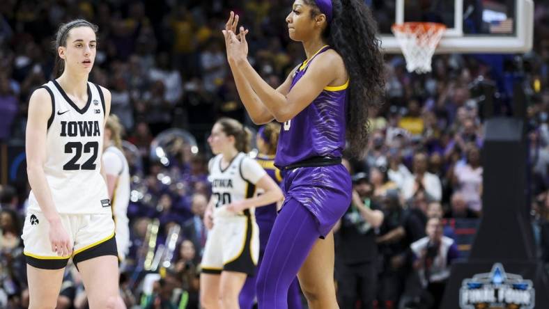 Apr 2, 2023; Dallas, TX, USA; LSU Lady Tigers forward Angel Reese (10) gestures towards Iowa Hawkeyes guard Caitlin Clark (22) in the second half during the final round of the Women's Final Four NCAA tournament at the American Airlines Center. Mandatory Credit: Kevin Jairaj-USA TODAY Sports