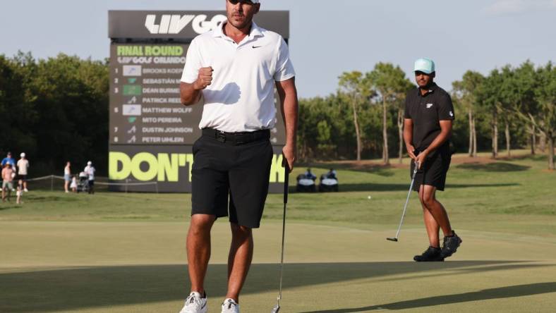 Apr 2, 2023; Orlando, Florida, USA; Brooks Koepka of the Smash golf club gives a fist pump after making the winning putt on the 18th green during the final round of a LIV Golf event at Orange County National. Mandatory Credit: Reinhold Matay-USA TODAY Sports