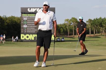 Apr 2, 2023; Orlando, Florida, USA; Brooks Koepka of the Smash golf club gives a fist pump after making the winning putt on the 18th green during the final round of a LIV Golf event at Orange County National. Mandatory Credit: Reinhold Matay-USA TODAY Sports